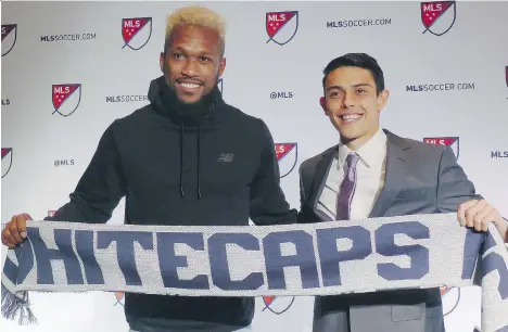  ?? NEIL DAVIDSON/THE CANADIAN PRESS ?? Whitecaps defender Kendall Waston welcomes University of Washington fullback Justin Fiddes to the team Friday at the MLS SuperDraft in Philadelph­ia. The Whitecaps took the speedy defender 17th overall followed by Creighton’s Lucas Stauffer at No. 26...