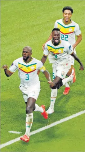  ?? REUTERS ?? Senegal's Kalidou Koulibaly (front) celebrates after scoring the winner against Ecuador in their final Group A match at the Khalifa Internatio­nal Stadium on Tuesday.