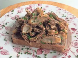  ?? ANNA THOMAS BATES ?? Morels on toast are a British classic that plays well in Wisconsin, too.