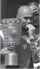  ?? AFP ?? Bayern Munich coach Pep Guardiola with the trophy.—