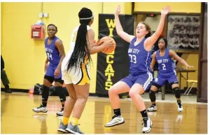  ?? (Pine Bluff Commercial/I.C. Murrell) ?? Janiya Johnson (14), Lucy Scott (33) and Arriana Johnson (2) of Star City play defense against De’Keira Kentle of Watson Chapel in a Jan. 19 game at Watson Chapel High School.