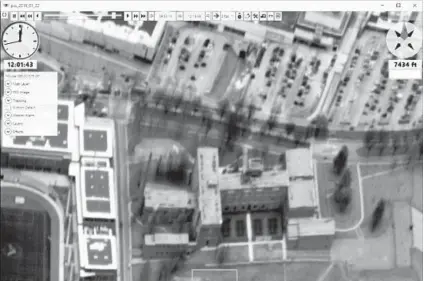  ?? PERSISTENT SURVEILLAN­CE SYSTEMS ?? A detailed aerial view of Douglass High School and the Mondawmin Mall parking lot. The donation process of two funds at the Baltimore Community Foundation allowed the police to conduct an aerial surveillan­ce program without telling residents.