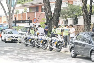  ??  ?? Police patrolling the areas outside the North Korean Embassy at Bukit Damansara, Kuala Lumpur. — Bernama photo