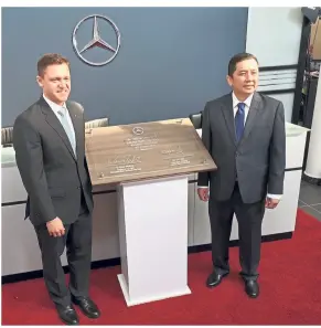  ??  ?? Dr Weidner (left) and Goh unveiling a plaque to mark the opening of the new showroom.