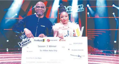  ??  ?? Adesola Adeduntan, managing director/CEO, FirstBank Nigeria Limited, presenting the sum of N10 million – one of the grand prizes – to Esther Benyeogo, winner of The Voice Nigeria, Season 3, following the grand finale of the globally acclaimed music talent hunt competitio­n, sponsored by FirstBank, which held in Lagos recently.