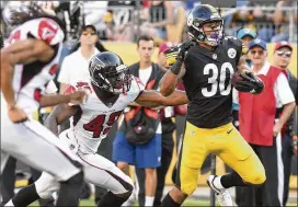  ?? DON WRIGHT / ASSOCIATED PRESS ?? Steelers running back James Conner picks up some of his 98 yards rushing in the exhibition victory over the Falcons in Pittsburgh.