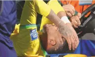  ?? MATILDE CAMPODONIC­O / ASSOCIATED PRESS ?? Brazil’s Neymar is carried off the field on a stretcher after being injured during a World Cup qualifying match against Uruguay on Tuesday in Montevideo, Uruguay.