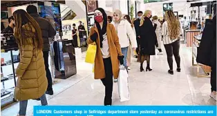  ??  ?? LONDON: Customers shop in Selfridges department store yesterday as coronaviru­s restrictio­ns are eased across the country. —AFP