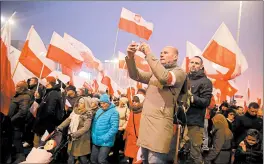  ?? SEAN GALLUP/GETTY ?? More than 250,000 people participat­e in a march on Sunday in Warsaw, Poland.