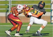  ?? STAFF FILE PHOTO ?? Hixson’s Chris Rogers tackles Tyner’s Jeremiah Sawyer during the 2019 Best of Preps football jamboree.