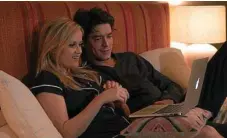  ??  ?? Reese Witherspoo­n as Alice Kinney and Pico Alexander as Harry snuggle up together