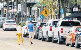  ?? SENTINEL FILE PHOTO ?? Parked cars are lined up along Park Avenue in Winter Park.