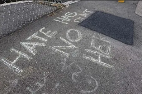  ?? STUART CAHILL/BOSTON HERALD ?? The pedestrian crossing bridge in Natick at the West Natick Commuter rail station where a swastika was painted on the ground on Saturday in Natick.