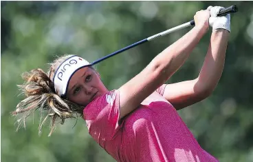  ?? — GETTY IMAGES ?? Brooke Henderson of Smiths Falls, Ont., lets go with her tee shot during first-round action Thursday in the LPGA’s CP Women’s Open in Regina.