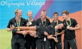  ?? PHOTO: PHOTOSPORT ?? Double medallist Lisa Carrington gets a helping hand from New Zealand team-mates yesterday.