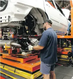  ?? DAVE CHIDLEY / THE CANADIAN PRESS FILES ?? Job cuts at General Motors’ CAMI plant in Ingersoll, Ont., “caught everybody off guard,” the union says.