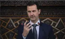  ?? THE ASSOCIATED PRESS FILE PHOTO ?? Syrian President Bashar Assad addresses the newly-elected parliament at the parliament building, in Damascus, Syria, in 2016.