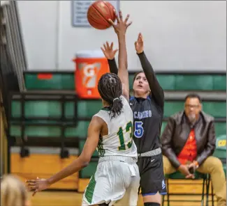  ?? Cory Rubin/The Signal (See additional photos on signalscv.com) ?? Canyon junior Chidinma Okafor records one of her five blocked shots in a non-league matchup with El Camino at Canyon High School Friday evening.