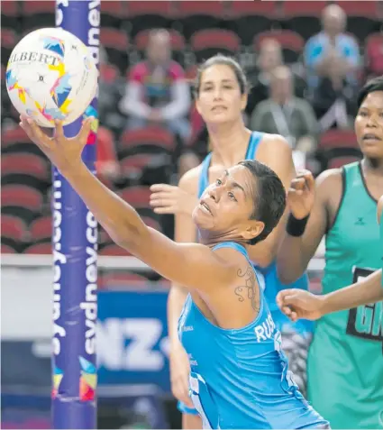  ??  ?? Fijian Pearls ace goal shooter Afa Rusivakula reaches out for the ball during the 2015 World Netball Championsh­ip while Taraima Mitchell looks on. Photo: