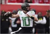  ?? RICK BOWMER — THE ASSOCIATED PRESS ?? Oregon quarterbac­k Bo Nix passed for two touchdowns and ran for another in Saturday's victory against Utah.