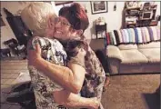  ?? GenaroMoli­na Los Angeles Times ?? JORDAN, right, hugs neighbor Freda Blair. Her vehicle was returned to her because of a legal glitch.