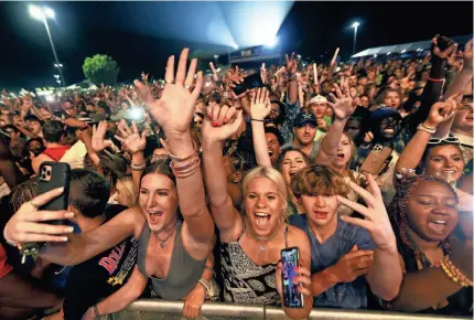  ?? JOE RONDONE/THE COMMERCIAL APPEAL ?? Fans cheer on Dababy as he performs on Beale Street Music Fest’s opening night at Liberty Park on April 29, 2022.