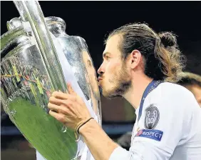  ??  ?? > If he can overcome a calf injury, Gareth Bale looks set for a triumphant Champions League homecoming in Cardiff. Real Madrid are 3-0 up as they face cross-city rivals Atletico Madrid in the semi-final second leg tonight