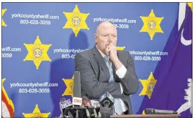  ?? Nell Redmond The Associated Press ?? York County Sheriff Kevin Tolson listens as a 911 call is played during a news conference Thursday in York, S.C., where he addressed the shooting by former Raider Phillip Adams.