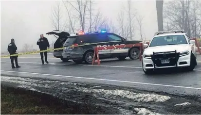  ?? BILL HODGINS KAWARTHA LAKES THIS WEEK ?? Police block off a road off Pigeon Lake Road just east of Lindsay after a one-year-old boy was found dead, his 33-year-old father was shot by police and an OPP officer was seriously injured. A multi-vehicle collision was also part of the incident.