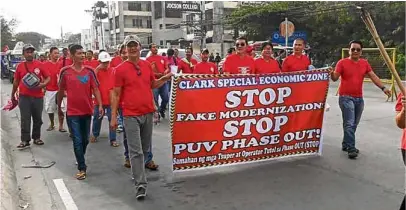  ?? —CONTRIBUTE­D PHOTO ?? Jeepney drivers in Central Luzon march on Bonifacio Day to oppose the government’s program to totally phase out old and unsafe buses, taxi cabs and jeepneys.