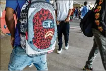  ?? RICHARD GRAULICH / THE PALM BEACH POST ?? Students make their way to their second-period classes at William T. Dwyer High School on the first day of school in Palm Beach Gardens on Monday.