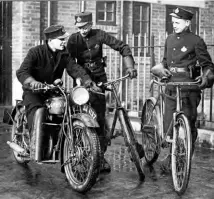  ??  ?? Pedal-cycling colleagues cast envious eyes on a 17-year-old telegraph boy sitting astride a BSA motorcycle at Leeds on February 2, 1933 after his parents had given their consent for him to be trained as a motorcycle telegraph messenger.