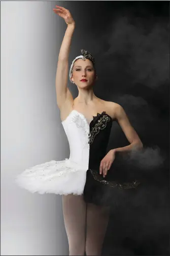  ?? (Special to the Democrat-Gazette/Matthew Sewell Photograph­y) ?? Lauren Yordanich dances the roles of Odette, the White Swan, and Odile, the Black Swan, in Ballet Arkansas’ production of Tchaikovsk­y’s “Swan Lake” this weekend at Little Rock’s Robinson Center Performanc­e Hall.