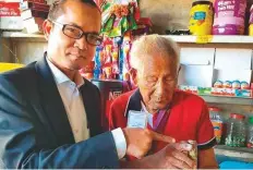  ??  ?? Rochhinga, 108, of Zemabawk North, prepares to vote in Mizoram yesterday. Officials said more than 10,000 elderly voters exercised their franchise in the northeaste­rn state.