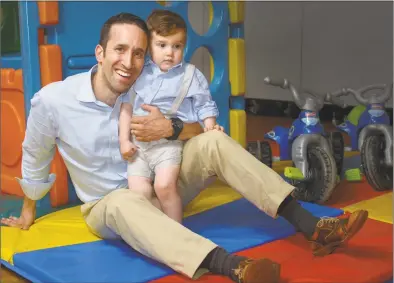  ?? Erik Trautmann / Hearst Connecticu­t Media ?? Craig Oshrin, and his 22-month-old son, Jacob, on Wednesday at Jacob’s day care center at Temple Shalom in Norwalk.