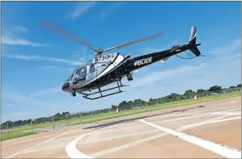  ??  ?? N730KC, one of two Oklahoma City police helicopter­s known as Air 1, takes off at the Air Support Unit in the Wheeler District in Oklahoma City. [NATE BILLINGS/ THE OKLAHOMAN]