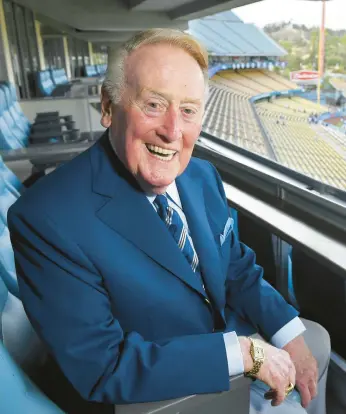  ?? MARK J. TERRILL/AP ?? Broadcaste­r Vin Scully poses for a photo at Dodger Stadium before a 2016 game against the Giants.
