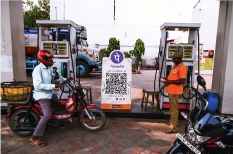  ?? Reuters ?? A petrol pump in West Bengal. Global companies are investing heavily in India’s digital sector and its infrastruc­ture