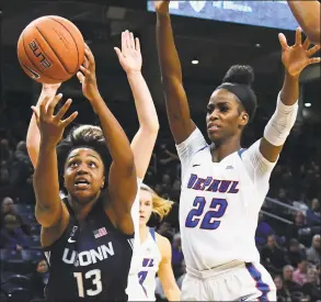  ?? Matt Marton / Associated Press ?? UConn guard Christyn Williams (13) grabs a ball away from DePaul guard Dee Bekelja, back, and forward Chante Stonewall (22) on Dec. 16.