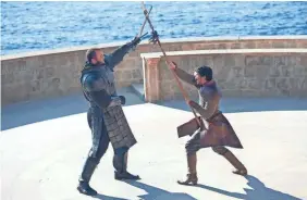  ?? MACALL B. POLAY/HBO ?? Julius Bjornsson as The Mountain and Pedro Pascal as Oberyn Martell do battle in “The Mountain and the Viper” episode.