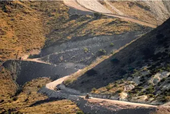  ?? AP Photo/Matt York ?? A pathway cleared by explosives to make way for border wall constructi­on separates Mexico, right, and the United States on Dec. 9 in Guadalupe Canyon, Ariz.