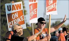  ?? CHRISTIAN GOODEN/AP ?? Production workers with UAW Local 2250 picket Monday outside the GM truck assembly plant in Wentzville, Mo.