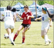  ?? Westside Eagle Observer/MIKE ECKELS ?? Lady Bulldog Jackie Mendoza (11) tries to intercept a Lady Caveman pass as teammate Emilee Flores tries to assist during the Cave City-Decatur first-round match of the 3A state girls soccer playoffs in Harrison Thursday afternoon. The Lady Cavemen took the win, ending the Lady Bulldogs’ 2022 season.