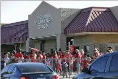  ??  ?? Teachers from Highland Arts Elementary School stage a final walk-in on in Mesa, Ariz. Communitie­s and school districts are preparing for a historic statewide teacher walkout on Thursday that could keep hundreds of thousands of students out of school...