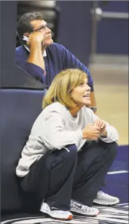  ?? Associated Press file photo ?? Connecticu­t coach Geno Auriemma, top, and associate head coach Chris Dailey can win their 1,000th game with the Huskies on Tuesday against Oklahoma.