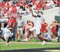  ?? Sam Greenwood / Getty Images ?? Wake Forest’s A.T. Perry (9) makes a reception for a touchdown against Rutgers in Friday’s Gator Bowl in Jacksonvil­le, Fla.