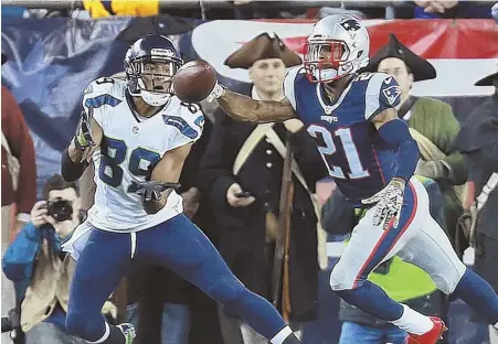  ?? STAFF PHOTO BY MATT WEST ?? OUT OF REACH: Cornerback Malcolm Butler arrives too late to break up a touchdown pass to Doug Baldwin during the Pats’ loss to the Seahawks last night.