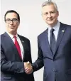  ?? PHOTO: REUTERS ?? United States Secretary of the Treasury Steven Mnuchin (left) and French Finance Minister Bruno Le Maire shake hands at the G20 meeting of finance ministers in Buenos Aires, Argentina, yesterday.