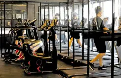  ?? —REUTERS ?? TAKING IT SLOW New curbs in Seoul bans fast music and treadmills in gyms to prevent members from breathing too hard or splashing sweat to others.