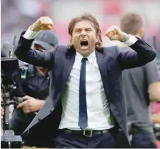  ?? — AFP ?? Chelsea manager Antonio Conte celebrates after a match.